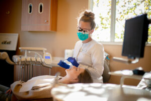 Dr. Stephanie Ness doing a check up on a patient. 