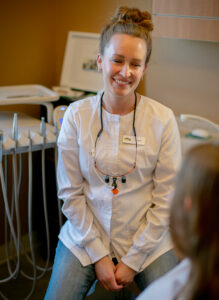 Photo of Dr. Stephanie Ness meeting with a new patient.